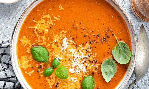Hot Tomato Basil Soup in a ceramic bowl